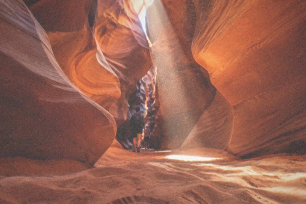 Glowing orange sandstone walls inside a narrow slot canyon
