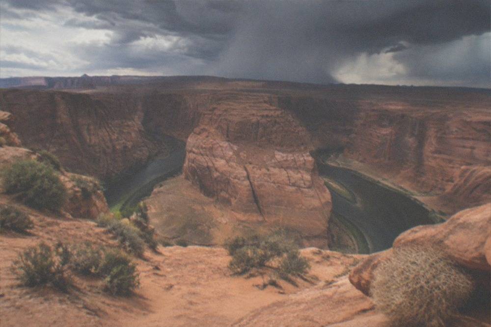 Dark monsoon clouds building over desert mesas near Page, Arizona