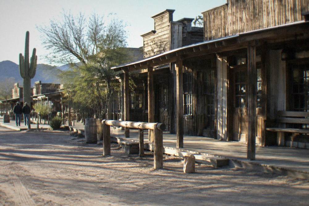 Historic wooden storefronts along the main street of an old western town