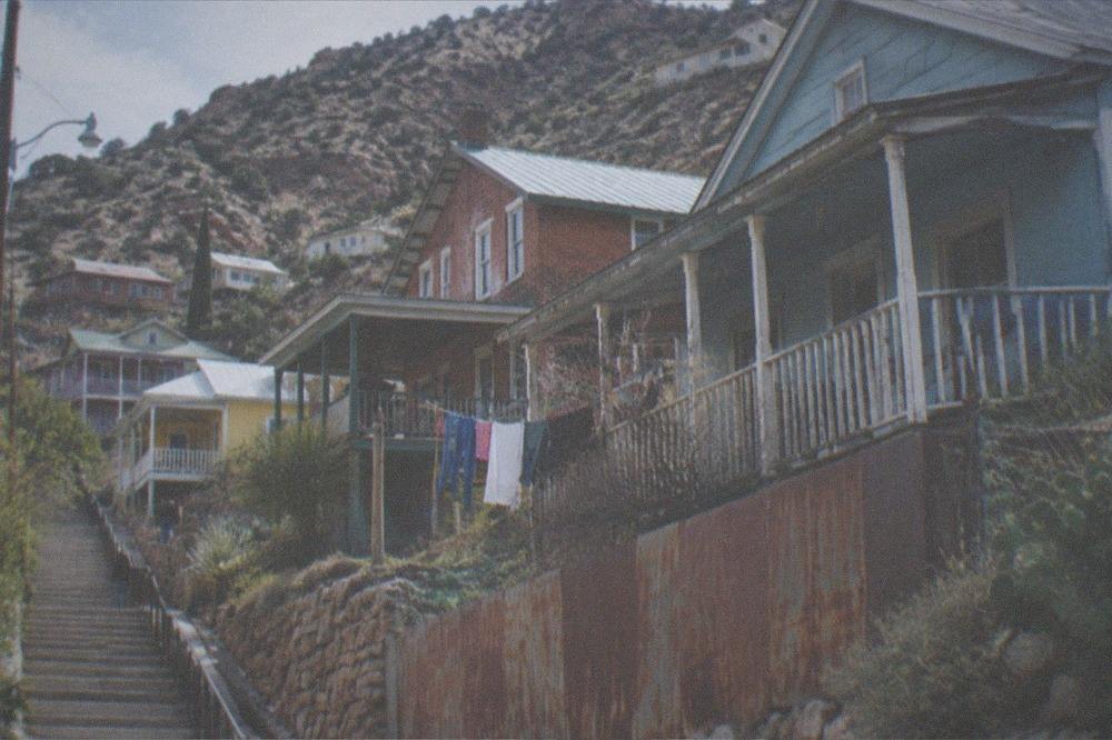 Colorful hillside buildings stacked on the slopes of a former mining town